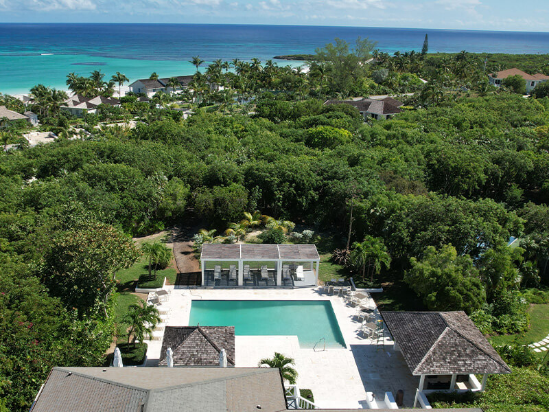 Aerial view image of The Club at Windermere Island. Several buildings and a pool can be seen.